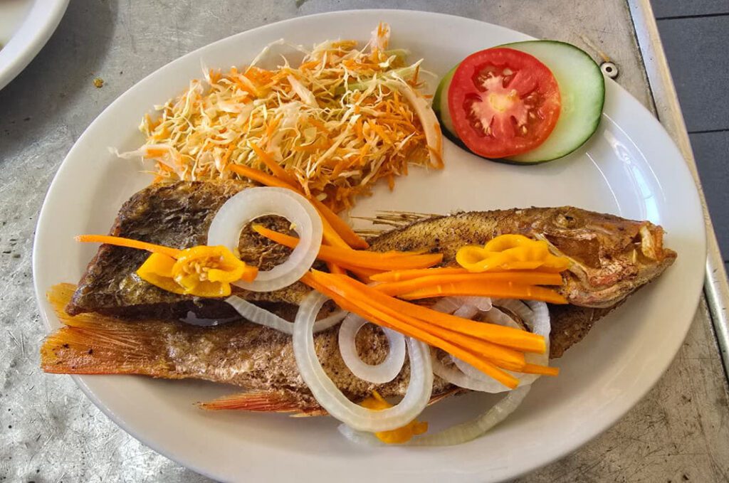 SS Unity Club restaurant fried fish dinner inside the restaurant in Linstead St. Catherine Jamaica”