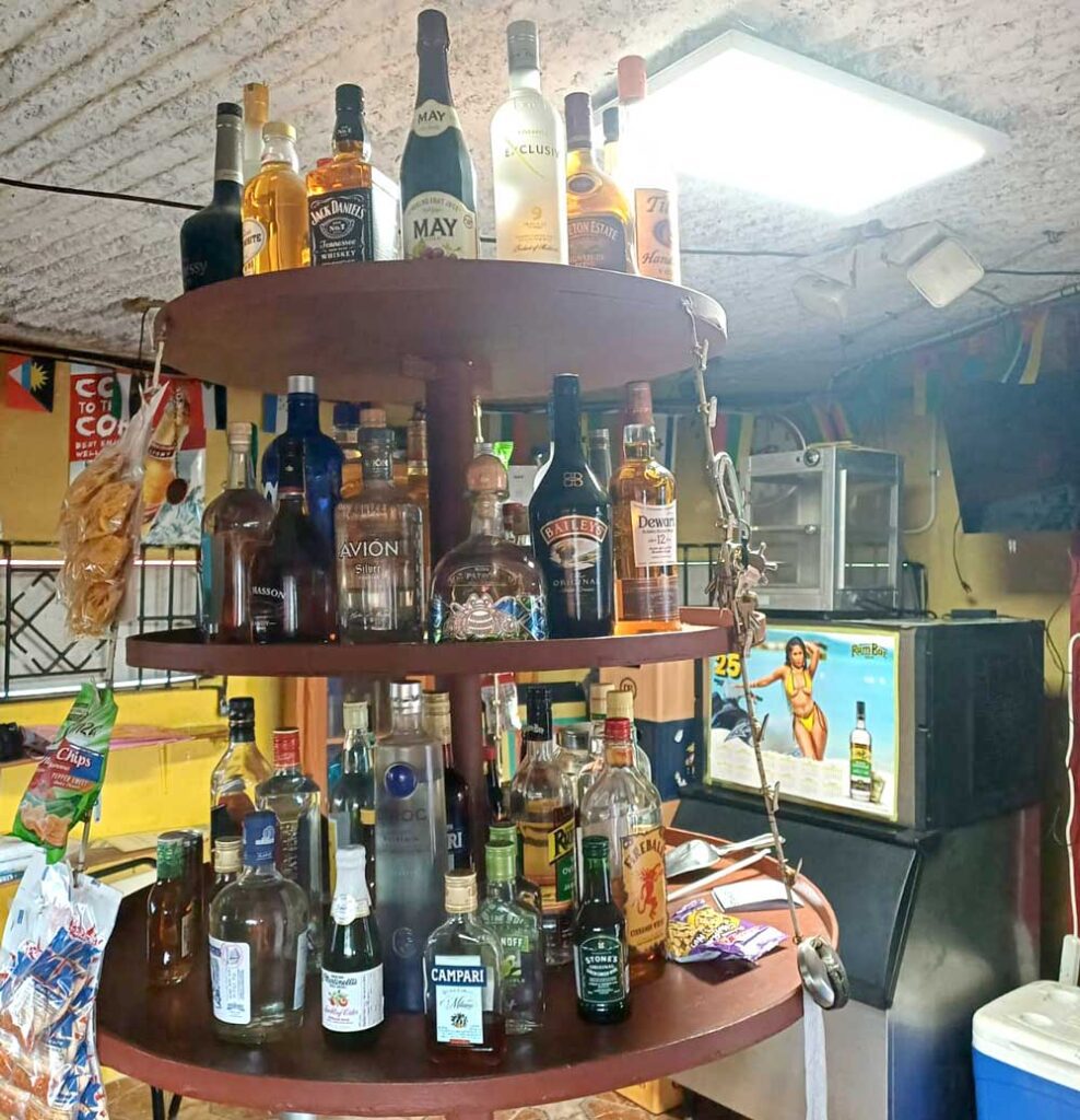 fully stocked alcohol bar inside SS Unity Club restaurant in Linstead St. Catherine Jamaica”